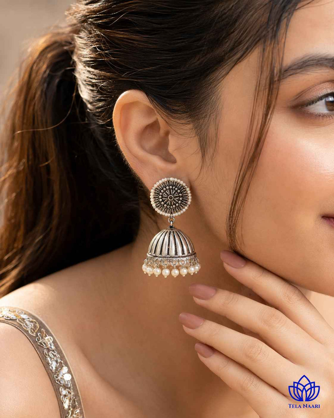 Oxidised silver finish gives this earring a striking antique texture.