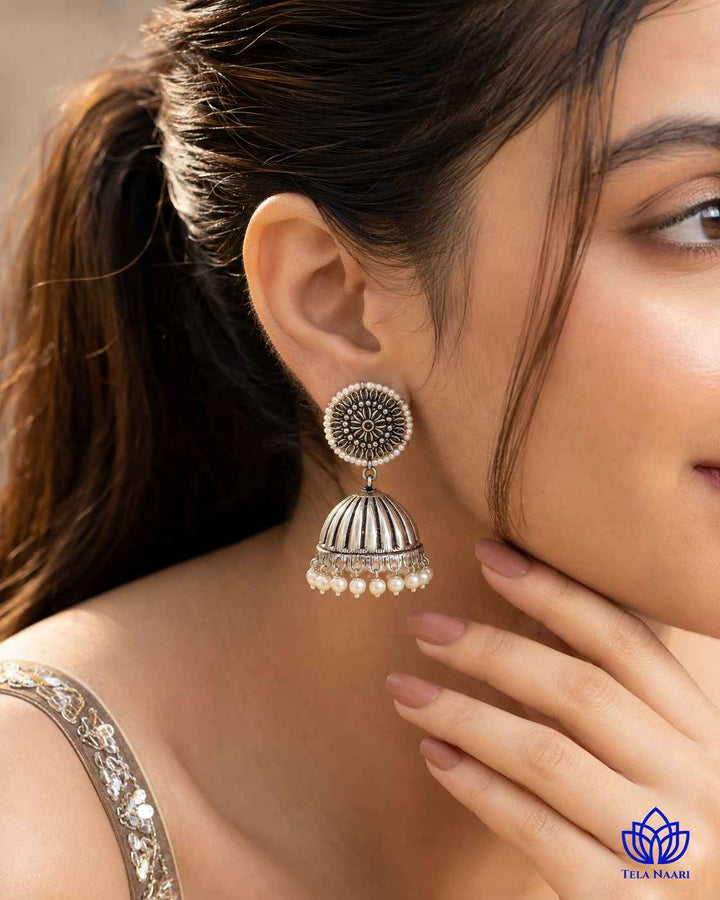 Oxidised silver finish gives this earring a striking antique texture.