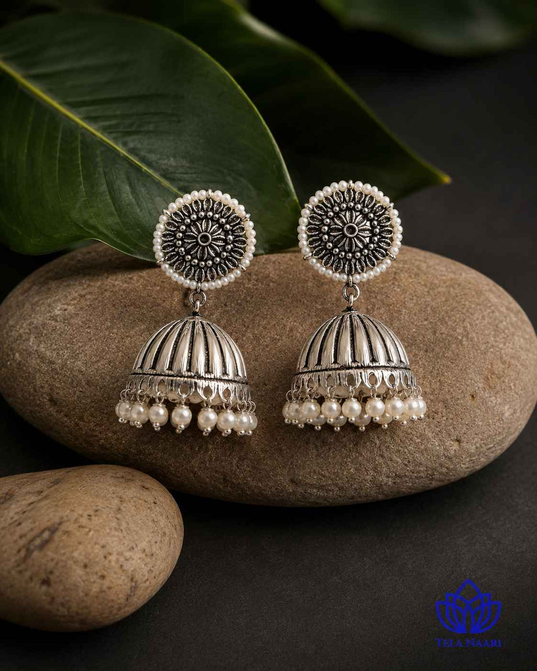Striking finish defines the silhouette of this oxidised earring pair.