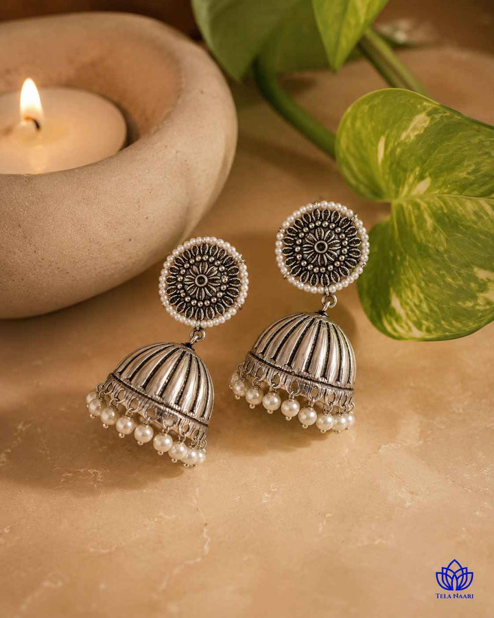 Textured surface catches the light across the oxidised silver finish.