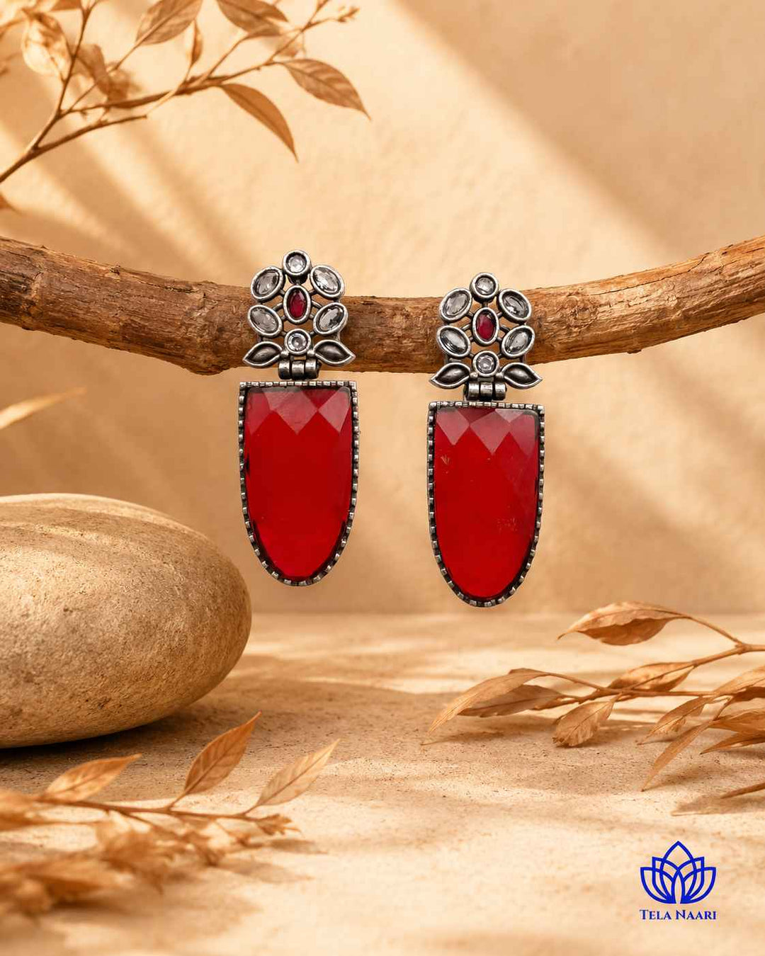 Striking silhouette highlights the bold red and silver combination.