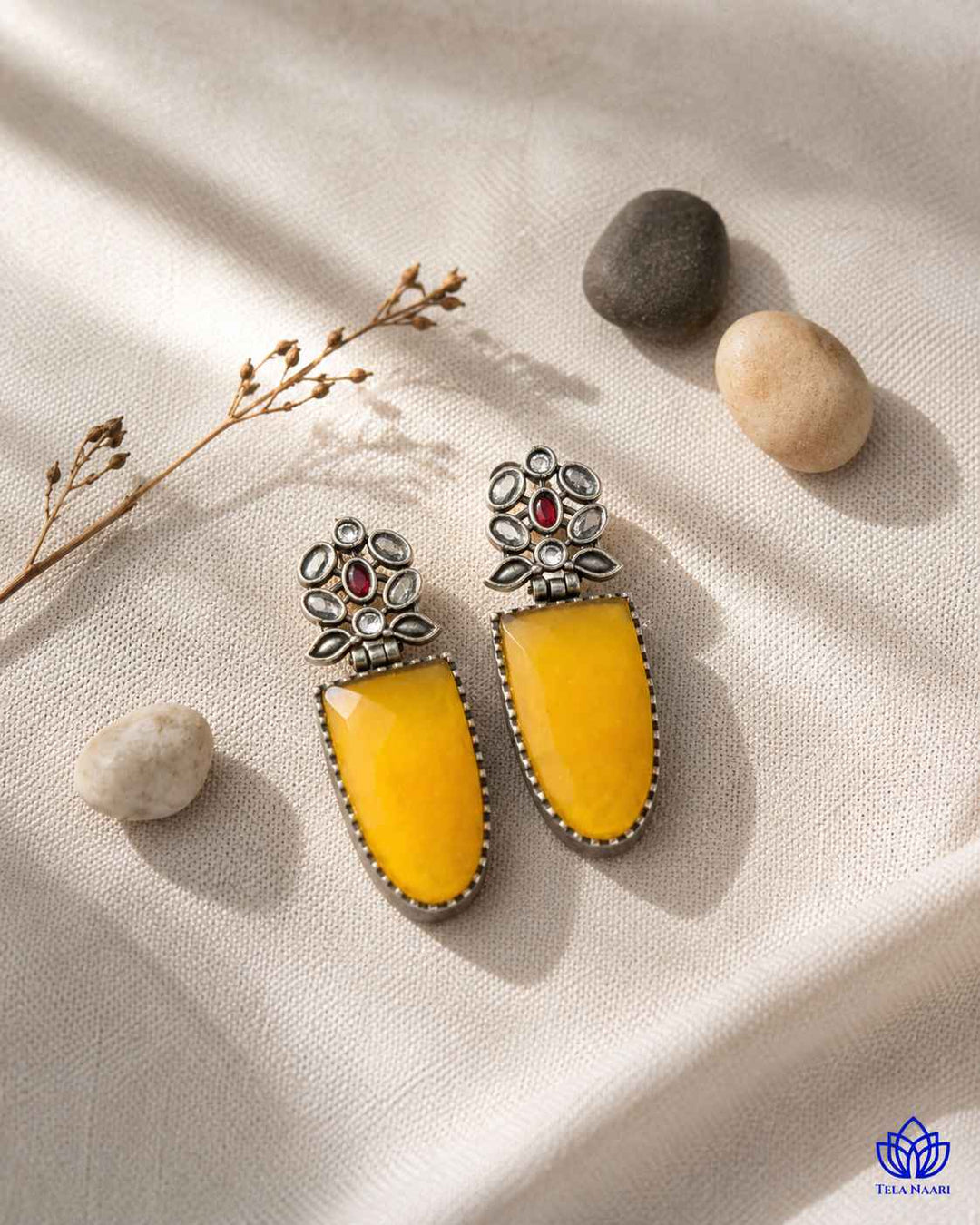 Stone detailing adds texture to this silver-plated statement earring.
