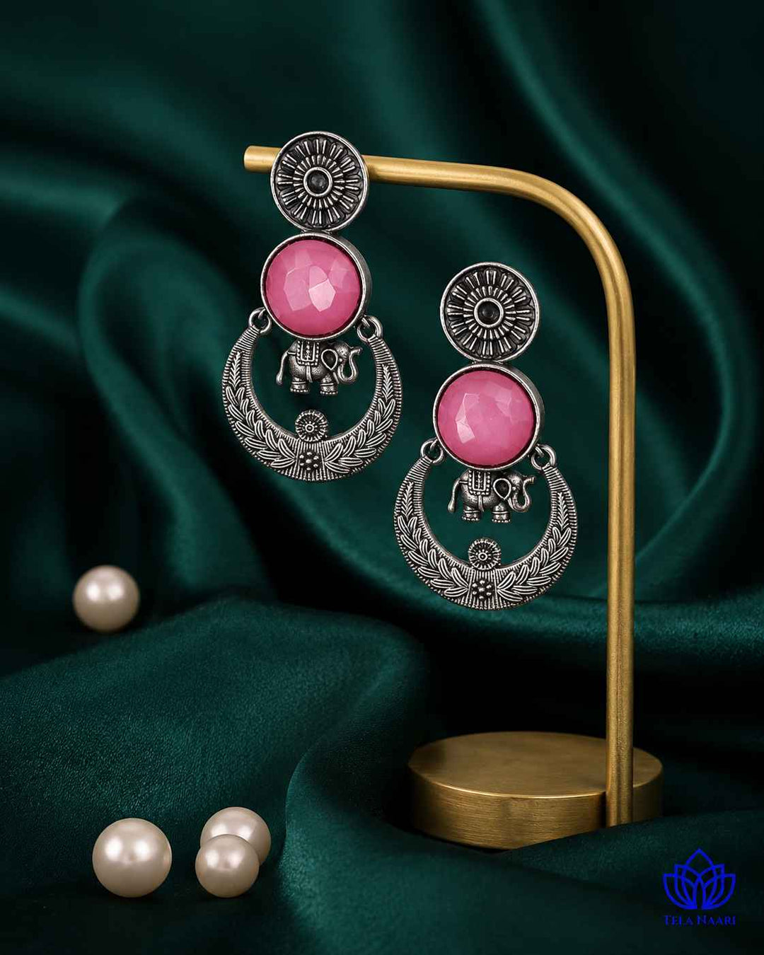 Brass construction supports the stone detailing of this earring.