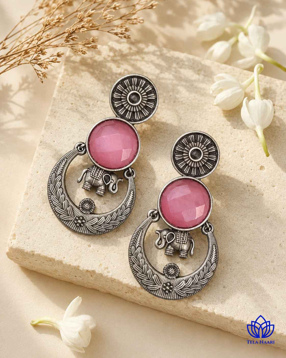 Glass bead detailing decorates the surface of this earring.