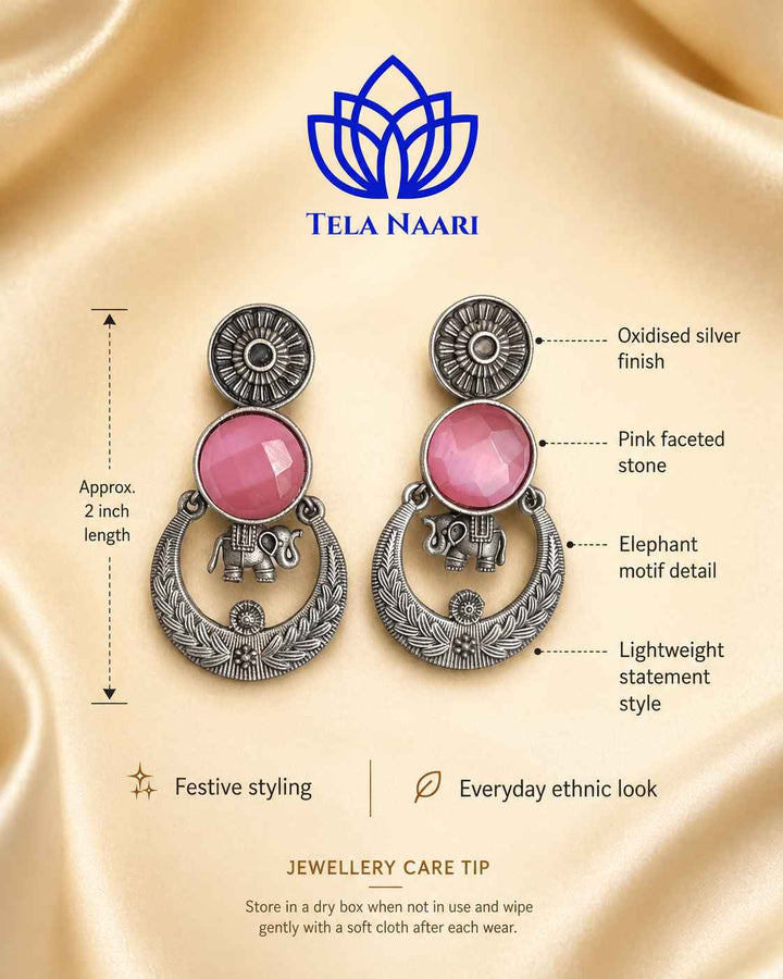 Pink tone brightens the silver-plated surface of this earring.