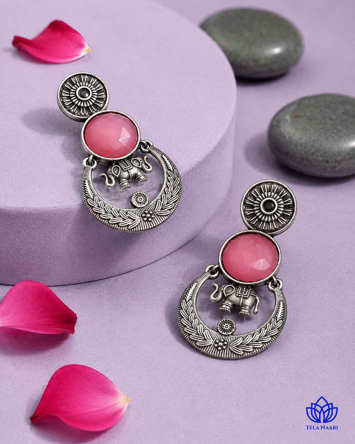 Push back closure secures this silver-plated stone earring in place.