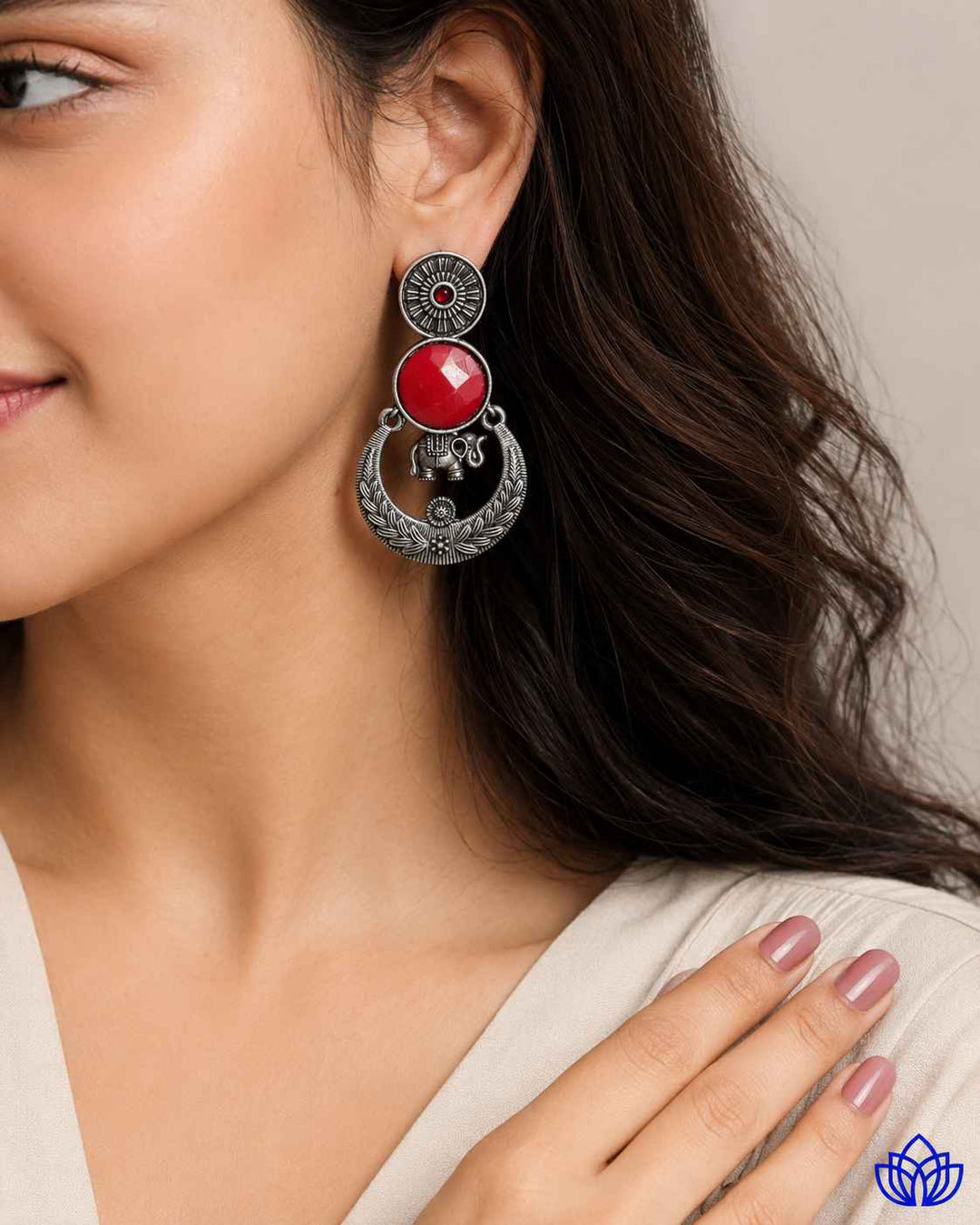 Ethnic craftsmanship shapes the stone silhouette of this earring.