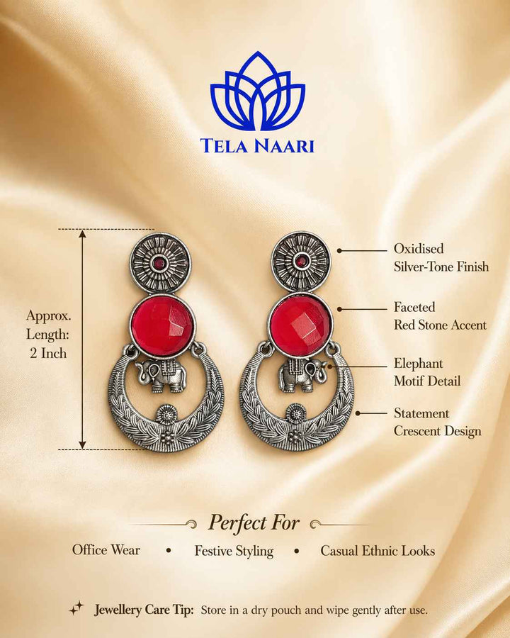 Festive detailing highlights the fiery red tones of this earring.