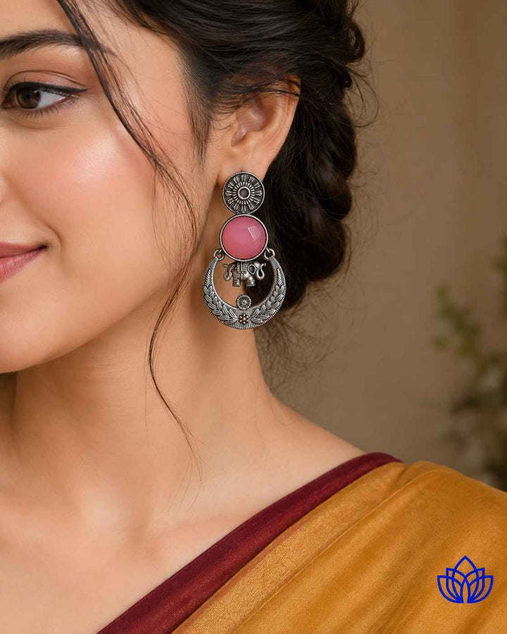Red accent brings colour to this silver-plated stone earring.