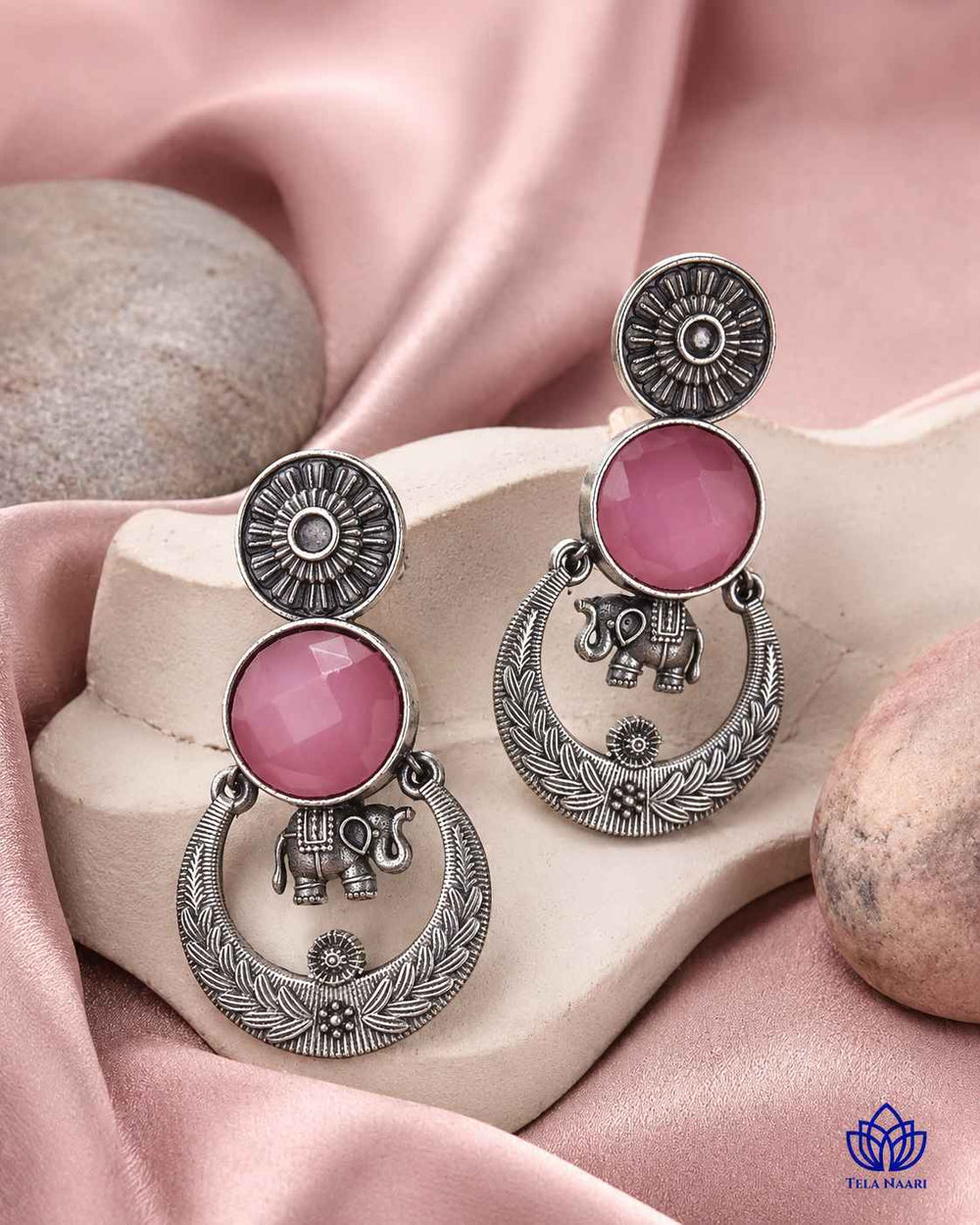 Silver-plated finish covers the surface of this stone earring.