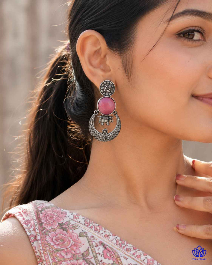 Textured surface combines glass beads with silver-plated stone detailing.