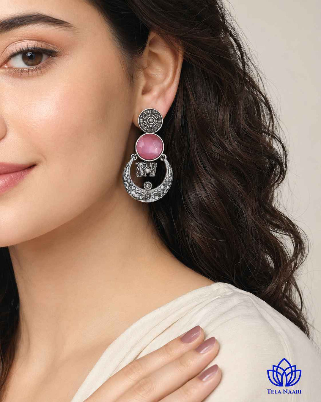 Versatile design pairs a silver-plated finish with ornate stones.