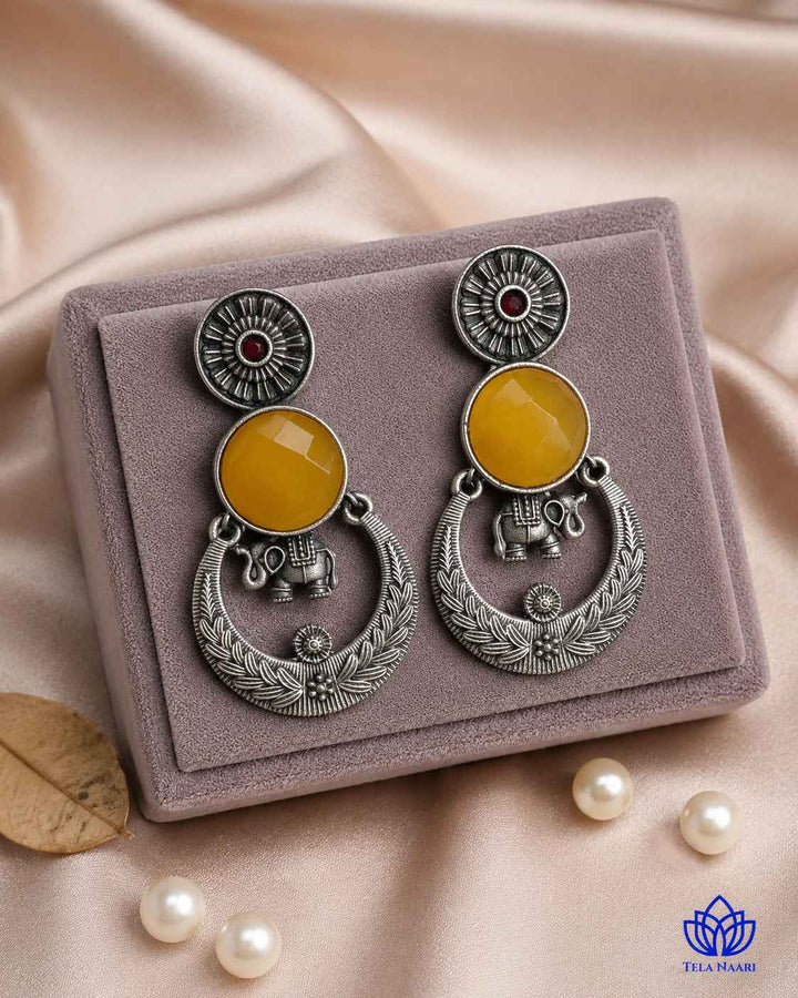 Textured surface combines glass beads with yellow stone detailing.