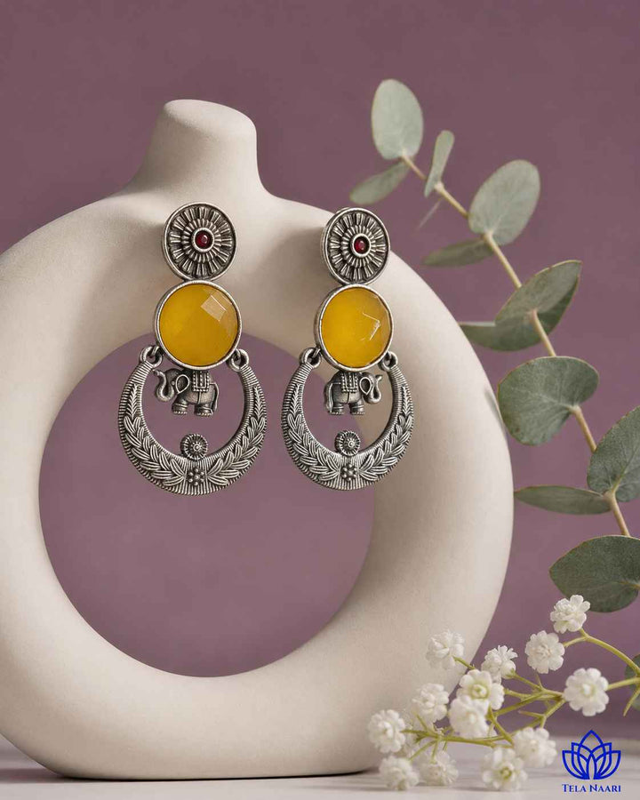 Versatile design pairs a silver-plated finish with golden stones.