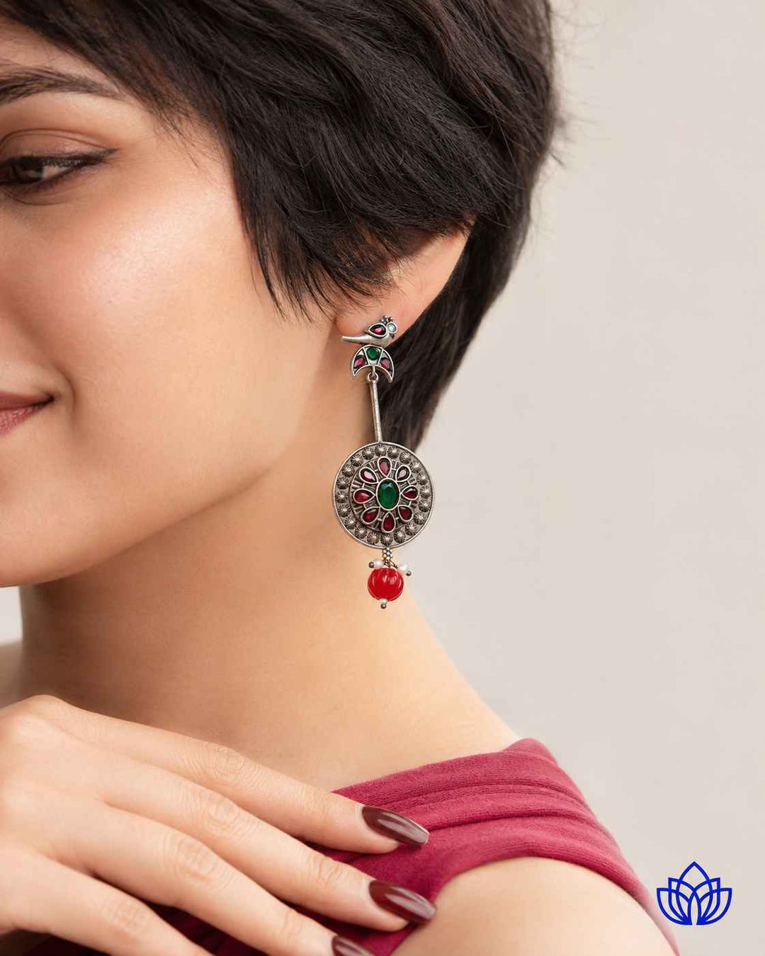Delicate glass beads add texture to this bird-motif design.