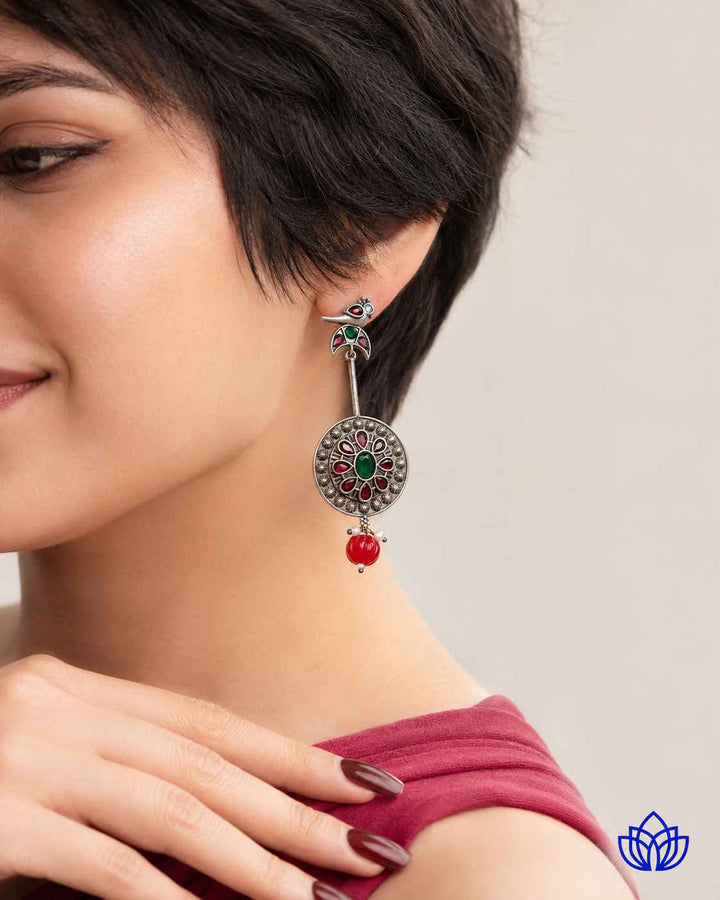 Delicate glass beads add texture to this bird-motif design.