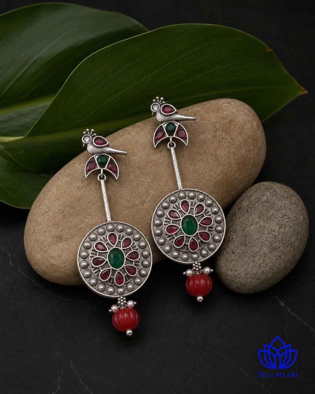 Quirky detailing brings the bird motif to life in silver.