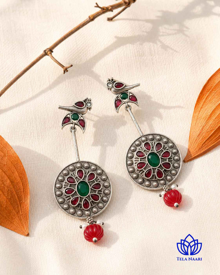 Silver oxidised polish gives this earring a textured antique finish.
