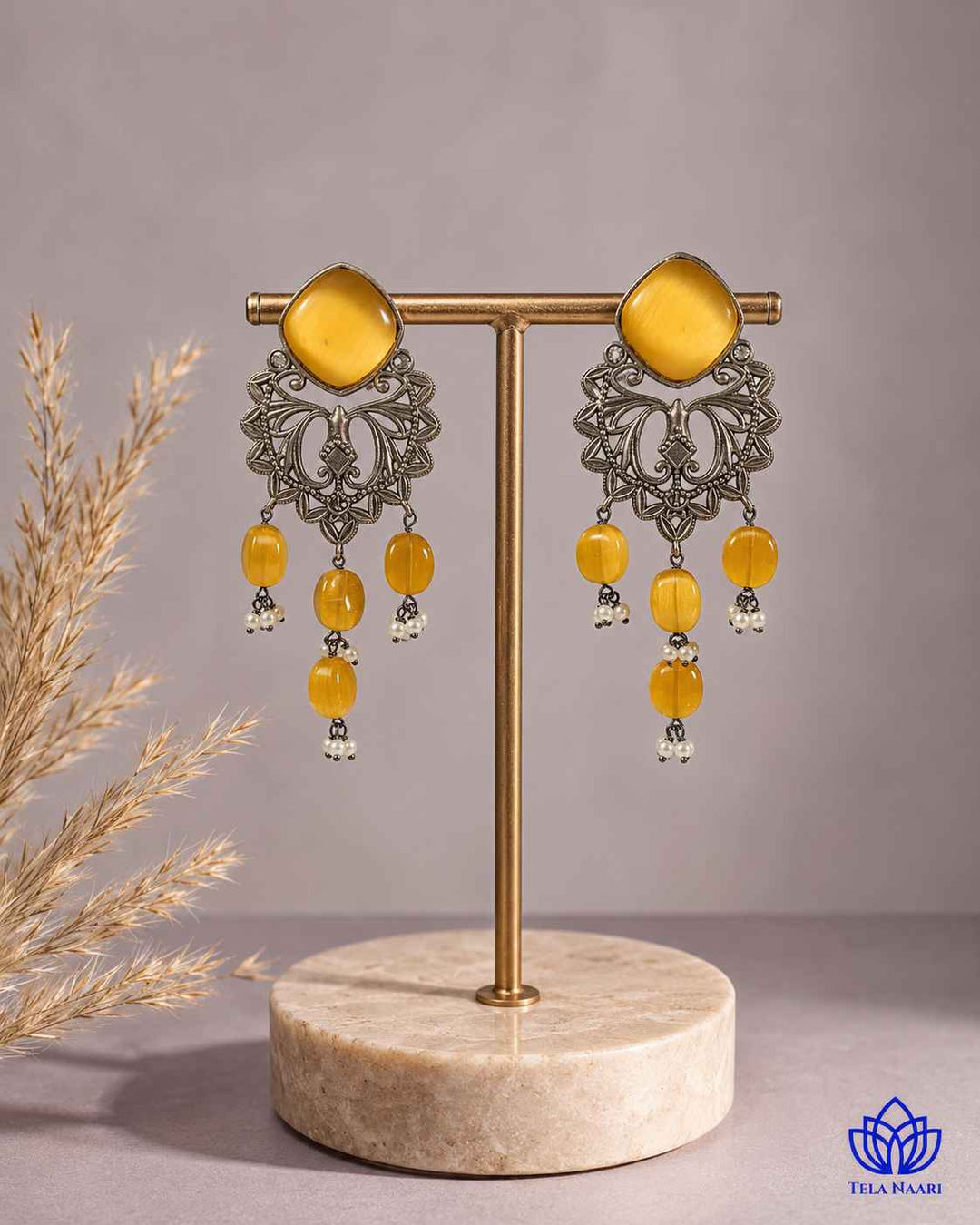 Polished oxidised finish gives this earring a textured antique surface.