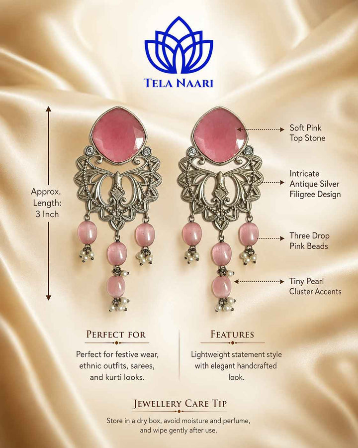 Festive detailing highlights the blossoming tones of this earring.