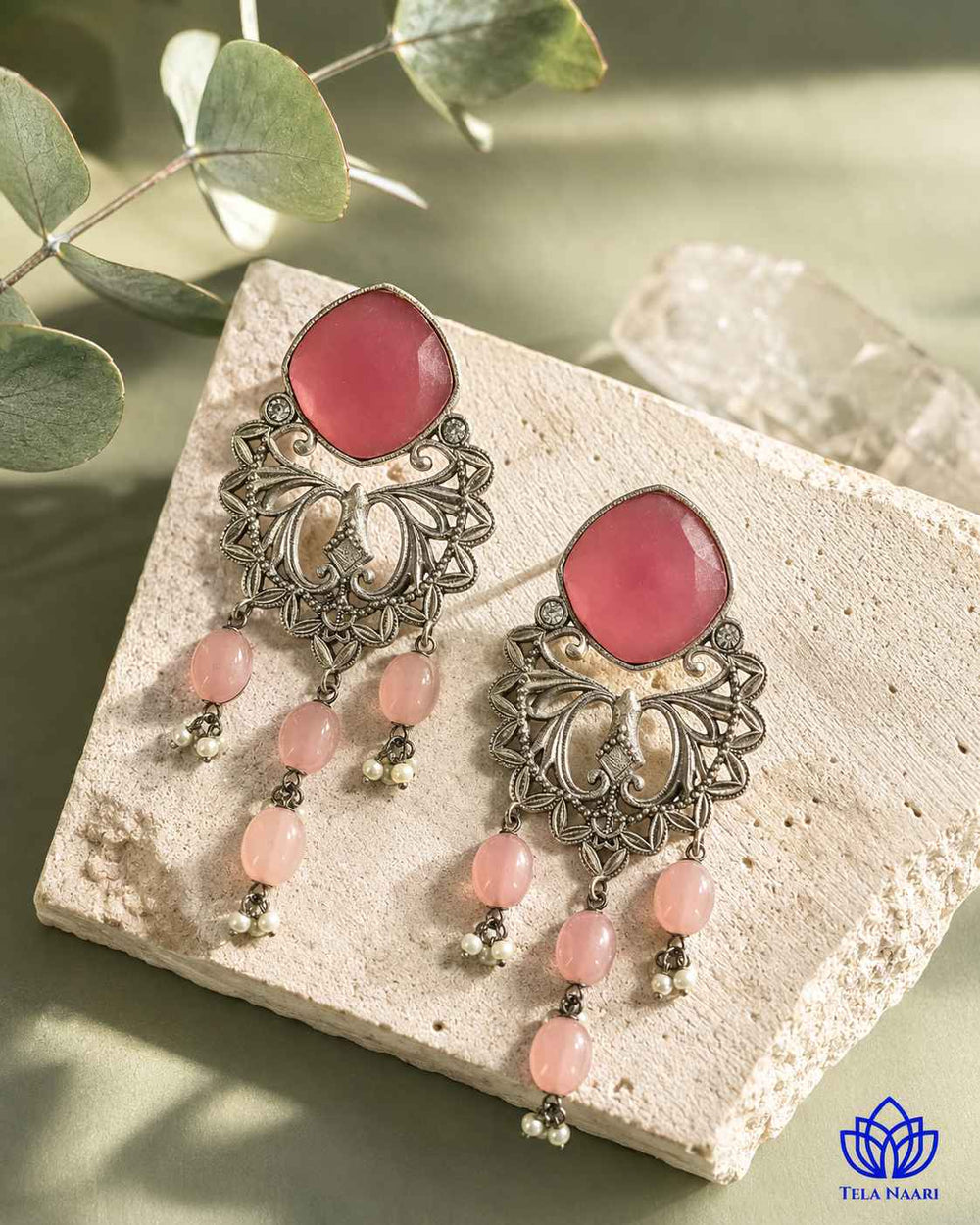 Silver-plated finish covers the surface of this dangler earring.