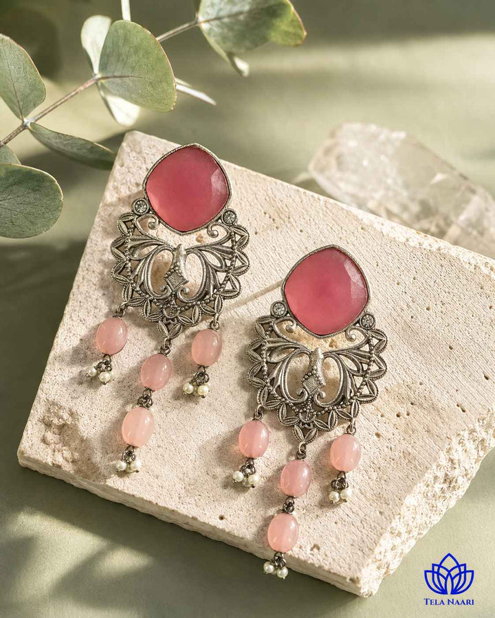 Silver-plated finish covers the surface of this dangler earring.