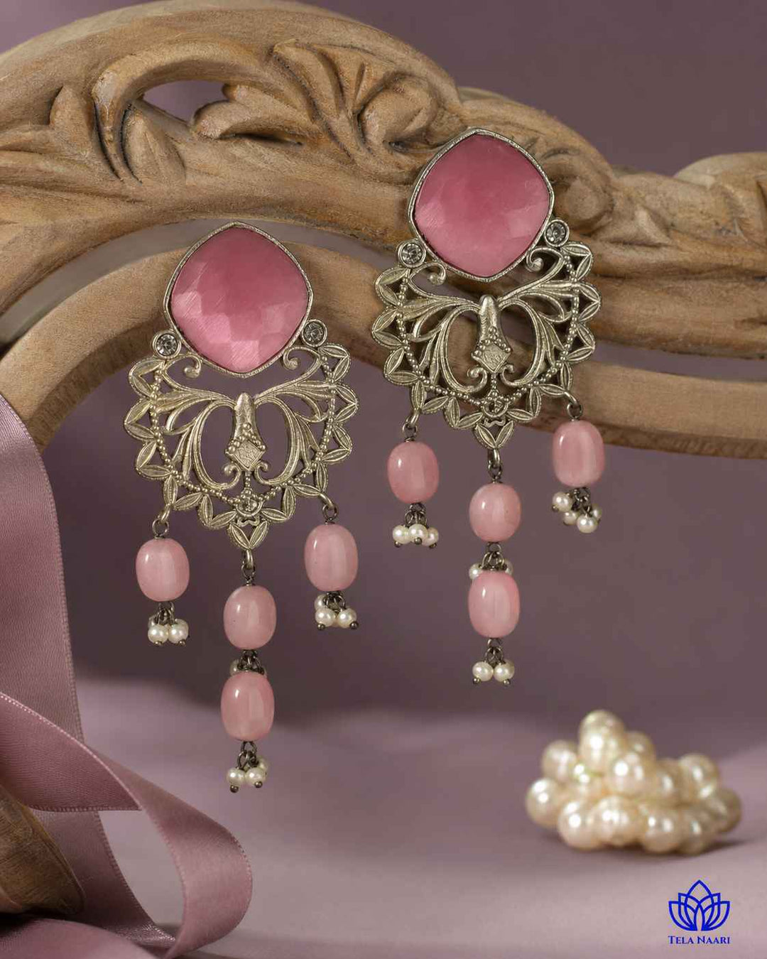 Textured surface combines glass beads with pink stone detailing.