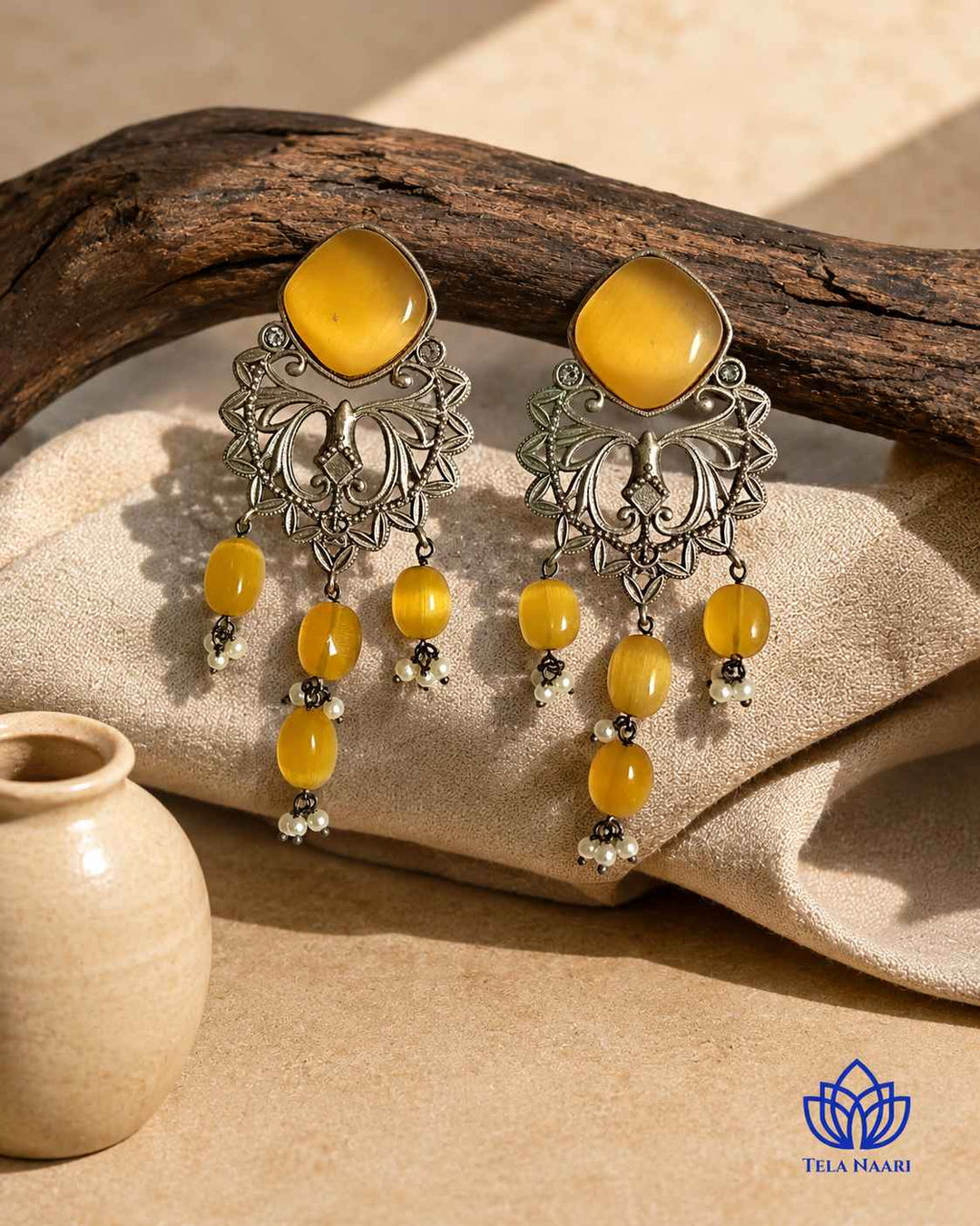 Lightweight dangler silhouette brings yellow elegance to this earring.