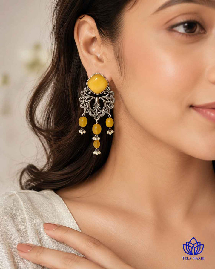 Iditri yellow silver-plated dangler earrings by Tela Naari – view 10