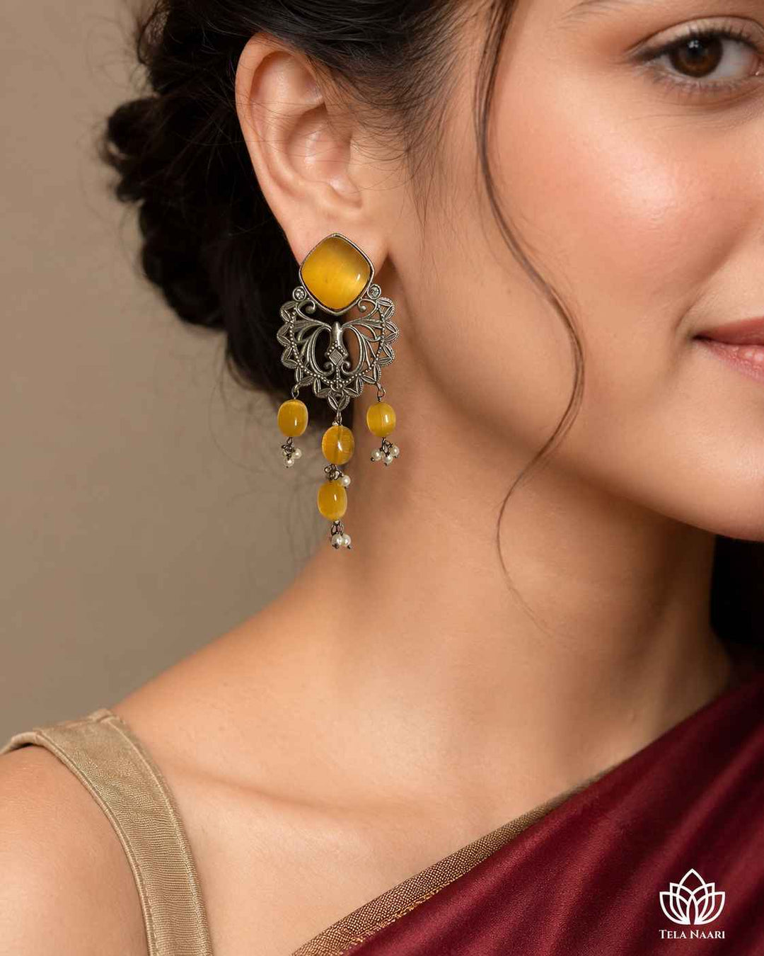 Iditri yellow silver-plated dangler earrings by Tela Naari – view 2