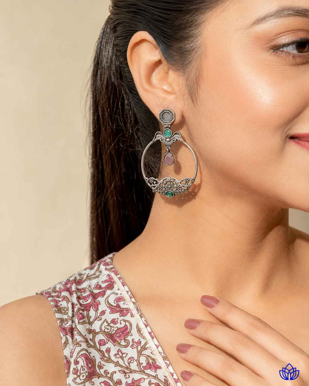 Pink accent brings colour to this silver-plated stone earring.