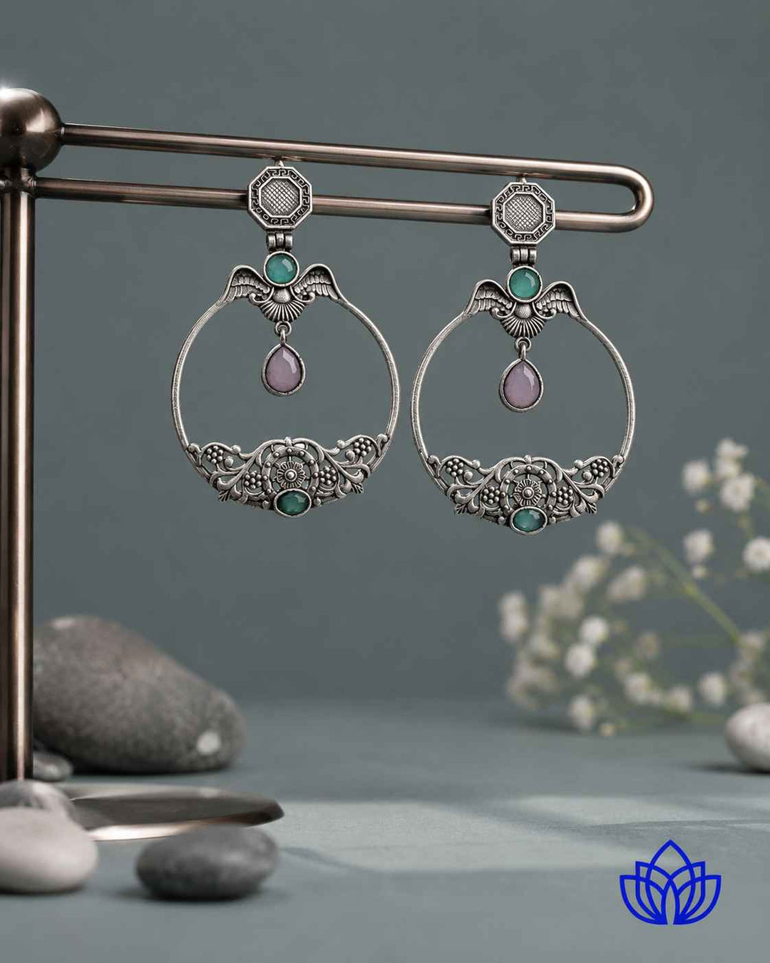 Push back closure secures this silver-plated stone earring in place.