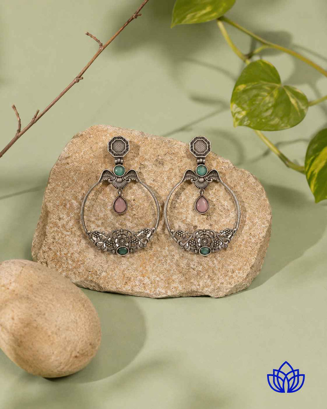 Sea green tone brightens the surface of this stone earring.