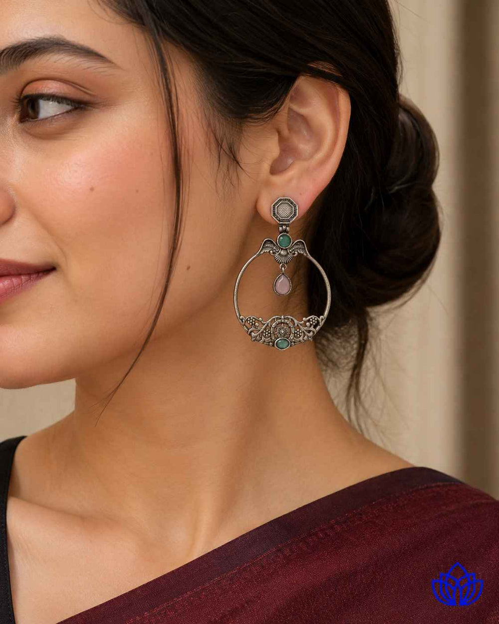 Silver-plated finish covers the surface of this stone earring.