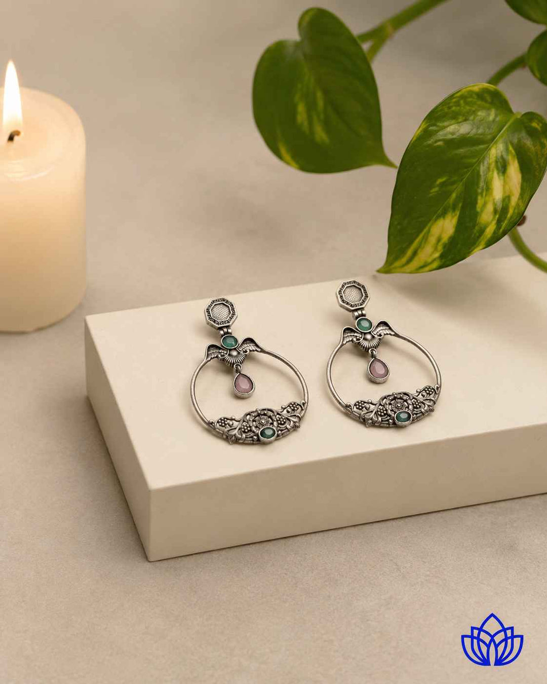 Textured surface combines glass beads with silver-plated stone detailing.