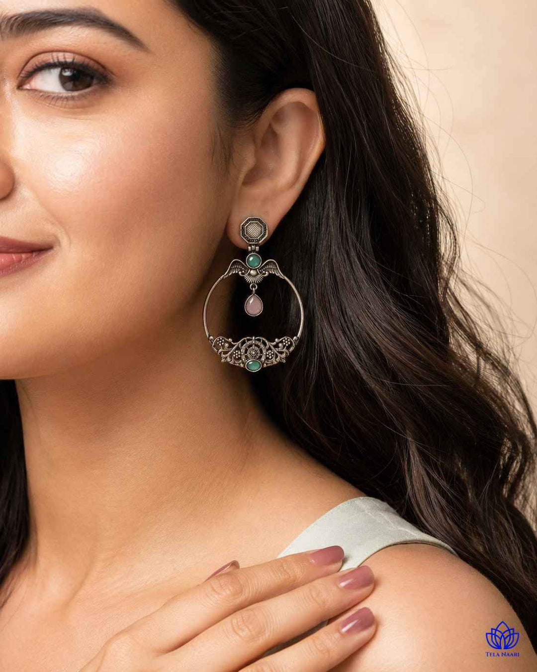 Versatile design pairs a silver-plated finish with layered stones.