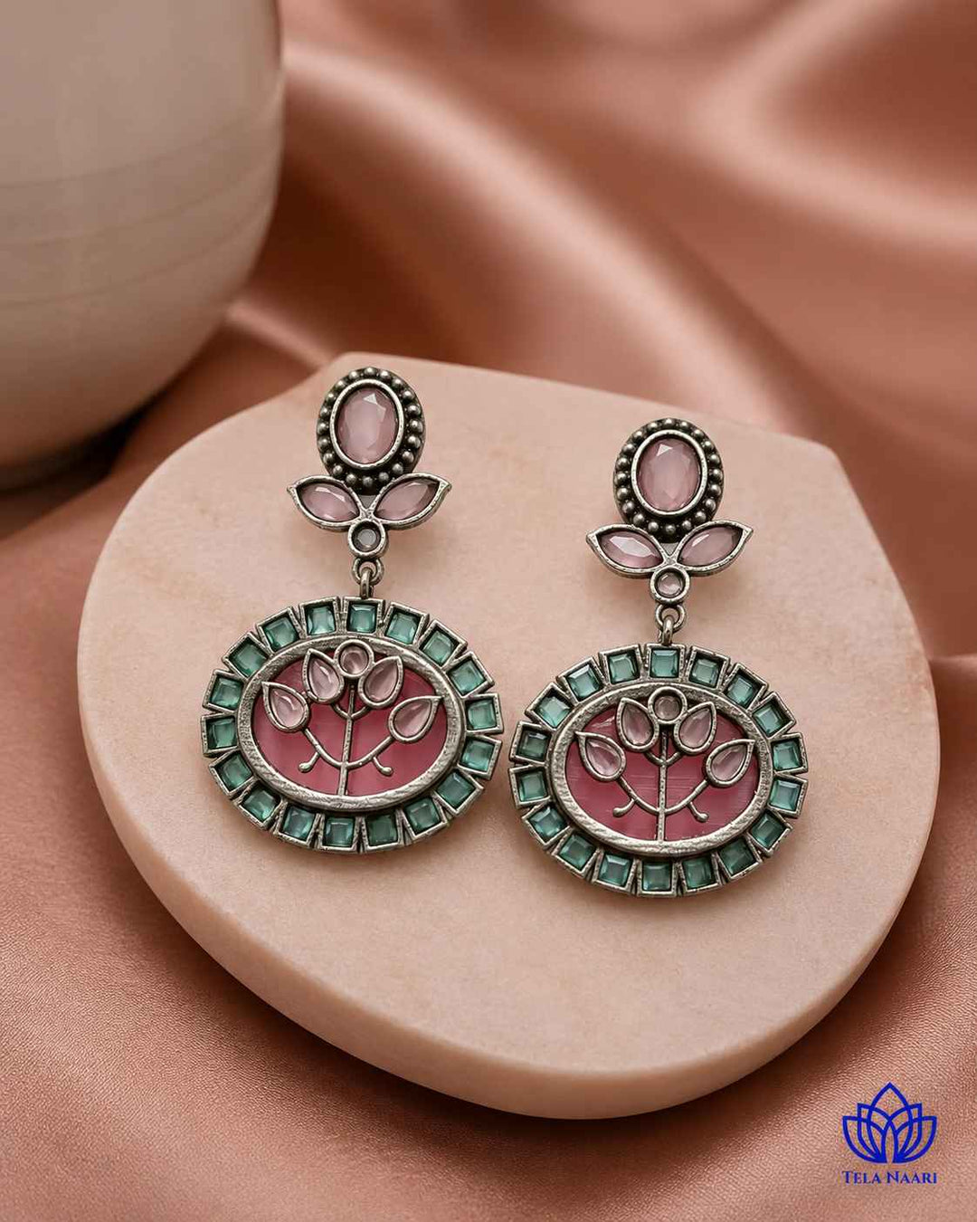 Multicolour stone detailing brings vivid texture to this pink earring.
