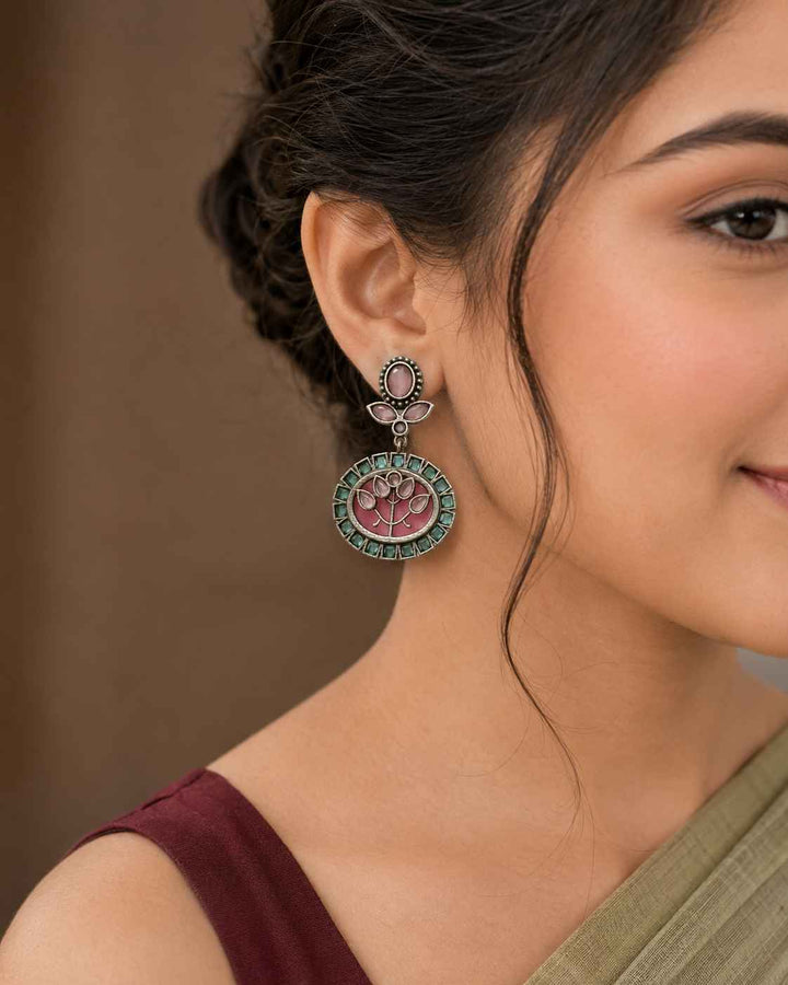 Silver oxidised polish gives this earring a textured antique finish.