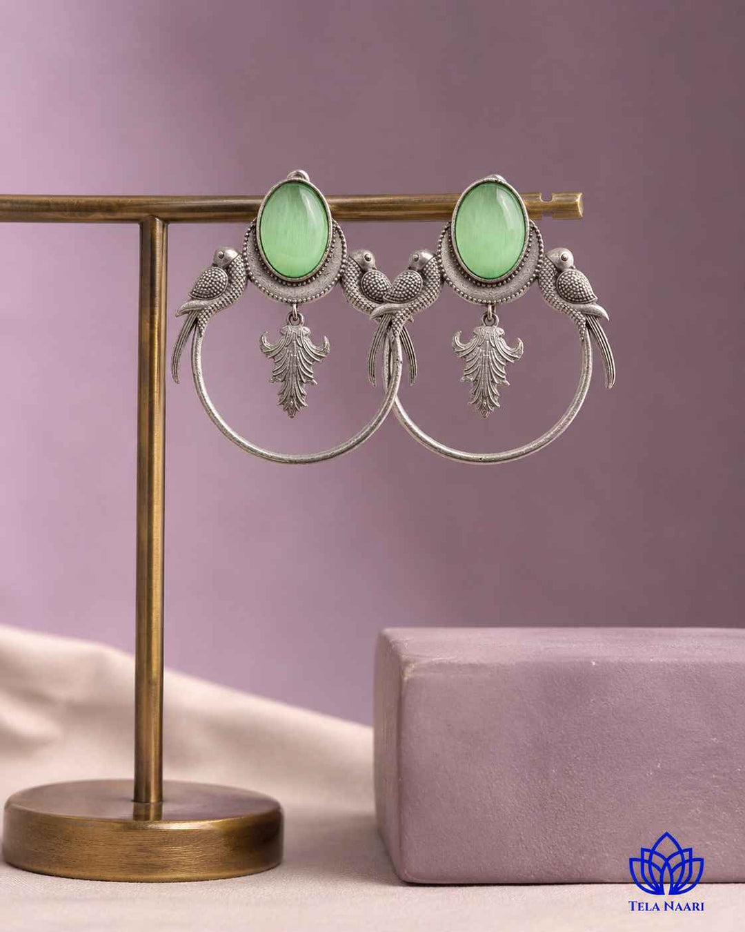 Charming detailing pairs a parrot silhouette with light green tones.