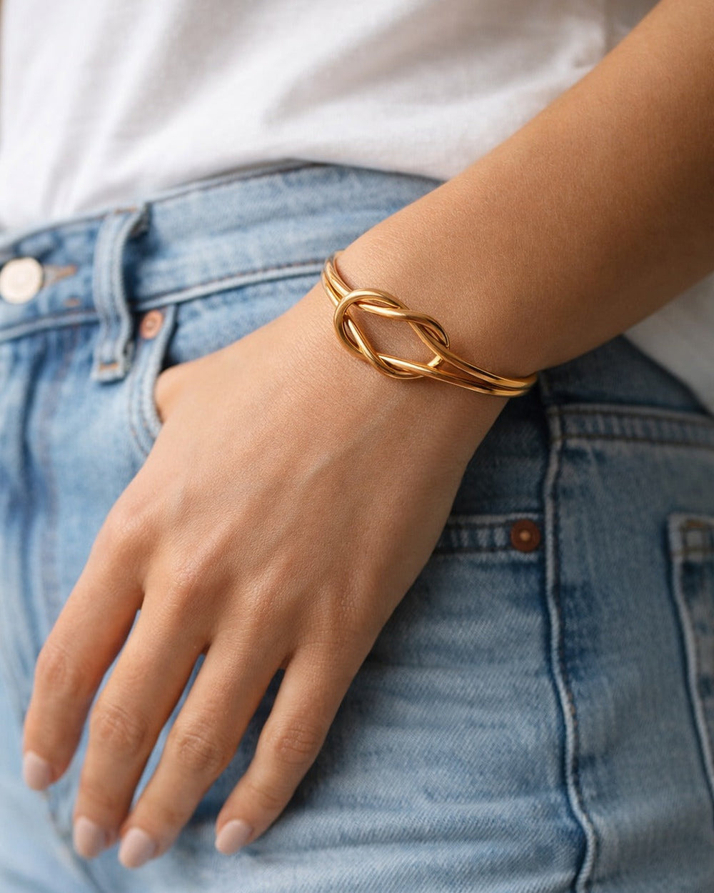 Gold-plated finish covers the surface of this stainless steel cuff.