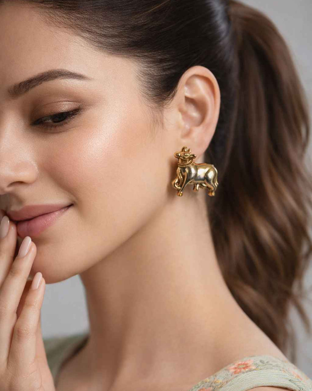 Dual-tone gold and silver plating covers the surface of this stud.
