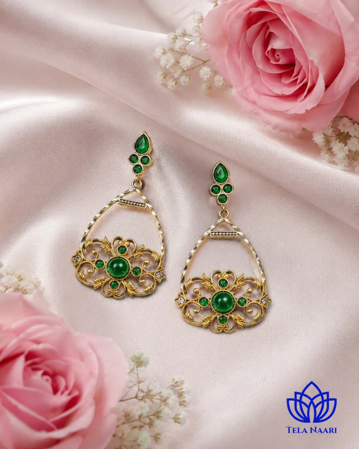 Brass construction forms the structure of this drop earring shape.