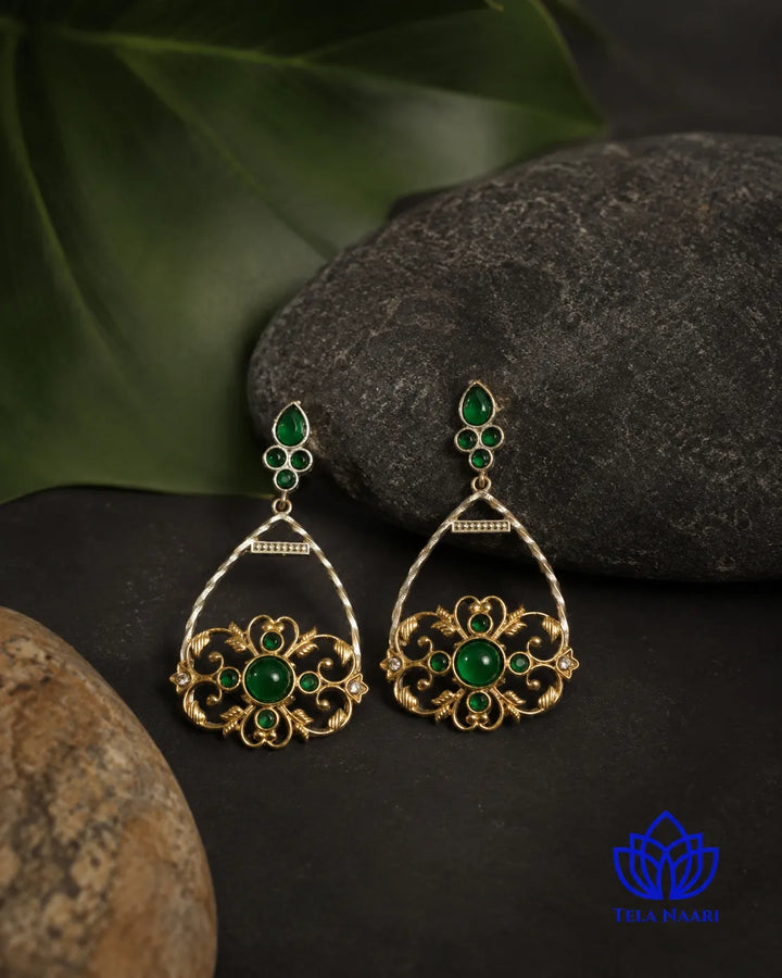 Dual-tone plating covers the surface of this drop earring.
