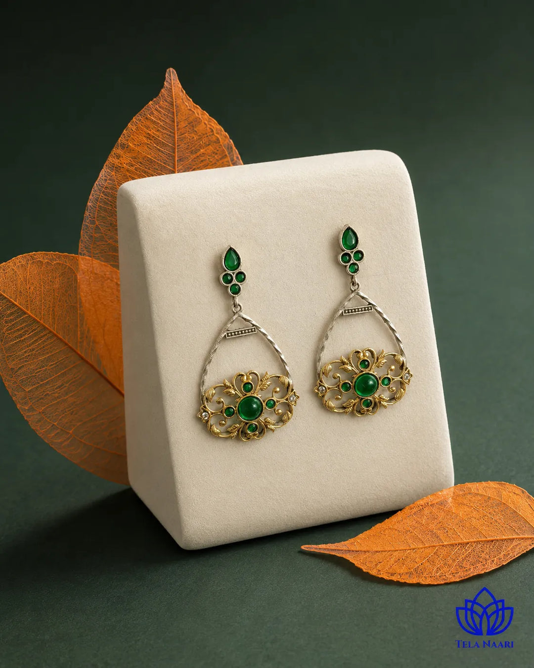 Mesmerising green stone sits at the centre of this drop earring.