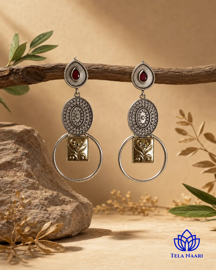 Sophisticated silhouette pairs warm and cool metallic tones.