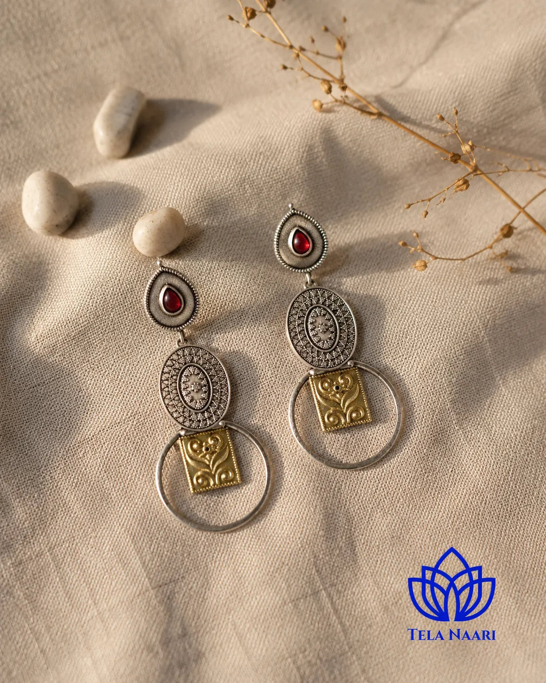 Vintage charm shapes the silhouette of this dual-tone earring.