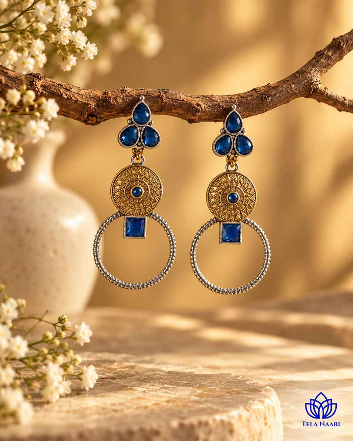 Layered finish gives this earring its dual-tone contrast.