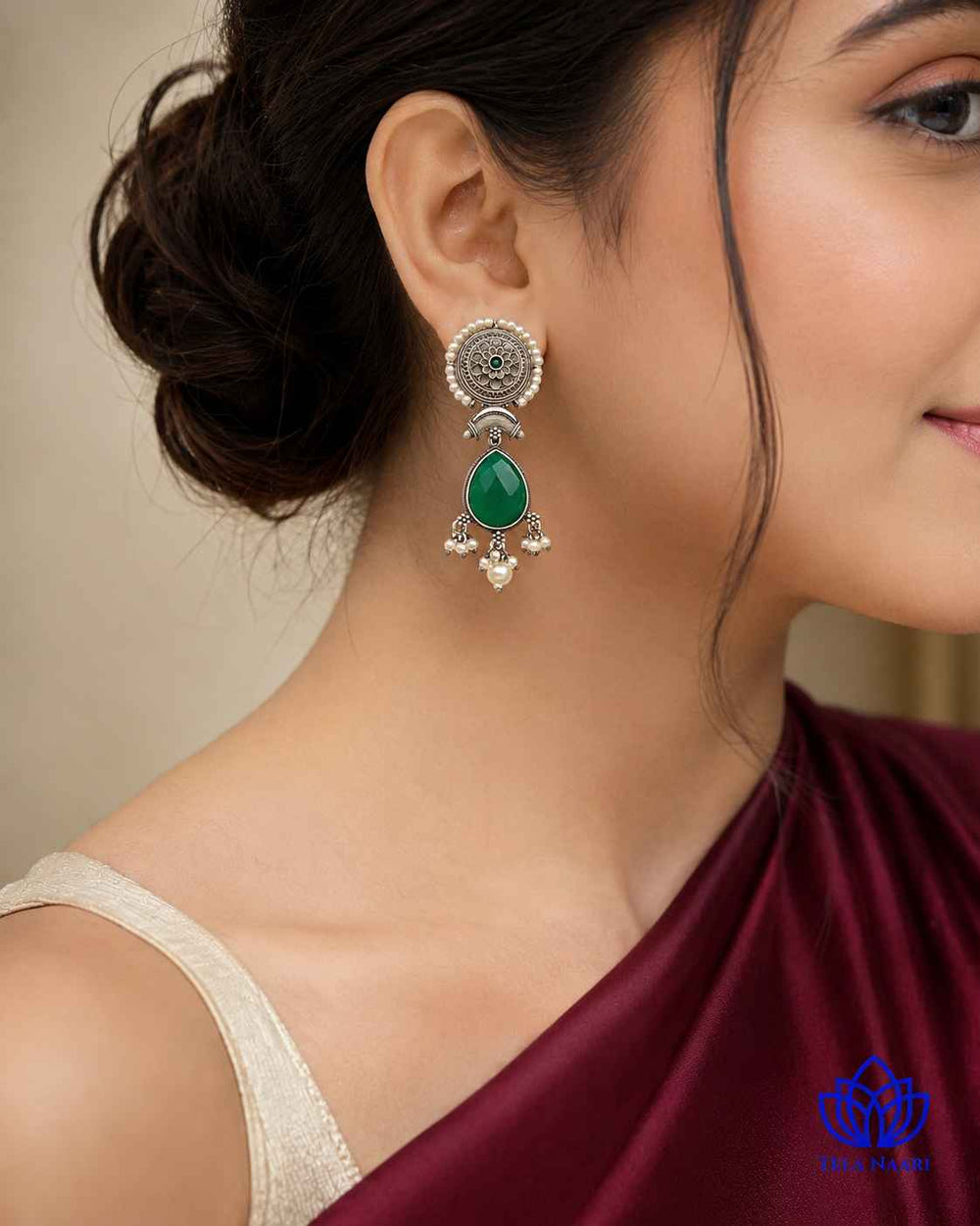 Silver oxidised finish covers the surface of this teardrop earring.