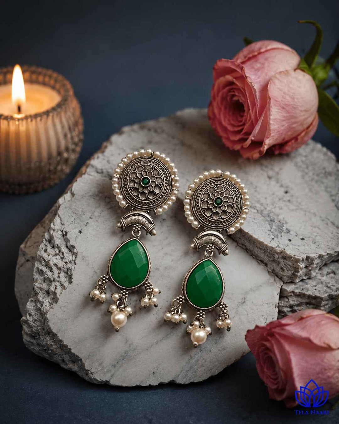 Textured surface combines glass beads with oxidised stone detailing.