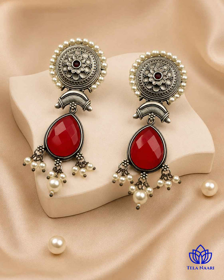 Silver oxidised finish gives this earring a textured antique surface.